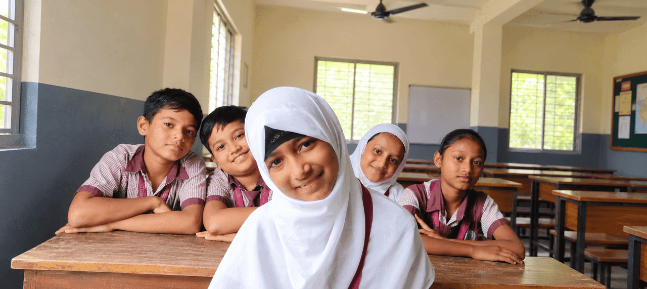 Students smiling in their classroom